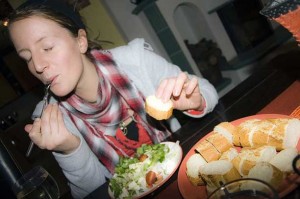 woman eating with her eyes closed