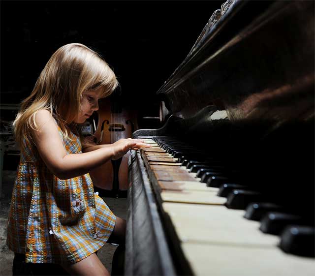 Girl Playing Piano - Unschooling and Self Worth